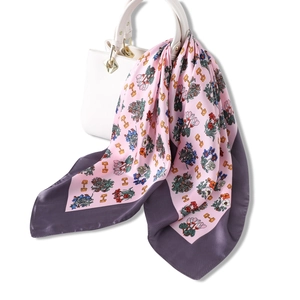 Fashionable floral silk scarf in pink and purple with golden chain pattern and border