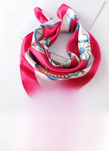 Detail of 60x60cm square silk scarf with horse carriage and chain print patterns