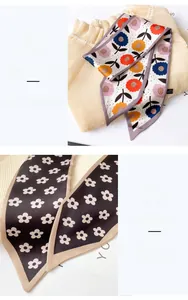 Detail showing fine stitching and smooth floral print silk scarf texture