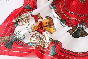 Detailed macro shot showing luxury satin texture and vintage horse carriage prints
