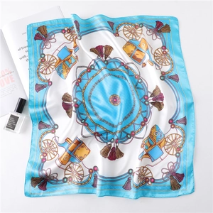 Detail view of blue and white satin square scarf with classic carriage and chain patterns