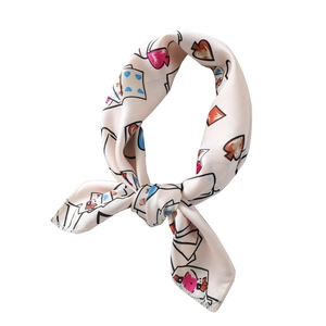 Silk-like satin scarf featuring heart poker card patterns on a creamy white base