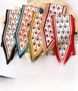 Detail of five multicolored ladybug geometric print scarves made of 100% polyester fabric