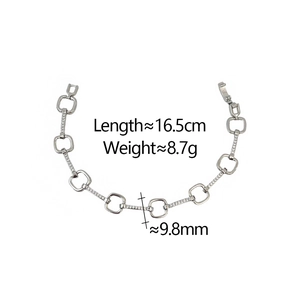 Macro detail of silver-tone link bracelet showing 16.5cm length and 9.8mm link width