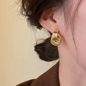 Minimalist layered gold hoop earrings for women with multi-circle interlocking design