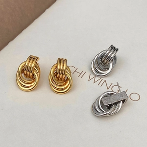 Minimalist multi-layer interlocking hoop earrings set in polished gold and silver finishes