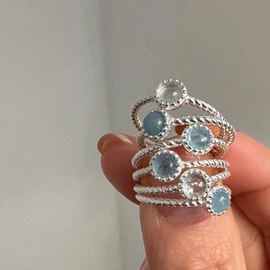6pcs set of minimalist twisted silver rings with round light blue gemstones for women