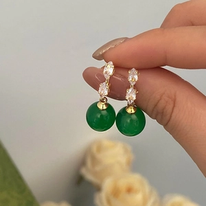 Elegant gold drop earrings featuring micro-set zircon and green chalcedony stone dangles