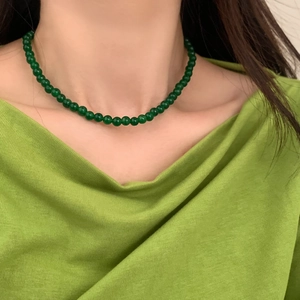 Deep green chalcedony beaded necklace on model for an elegant minimalist aesthetic