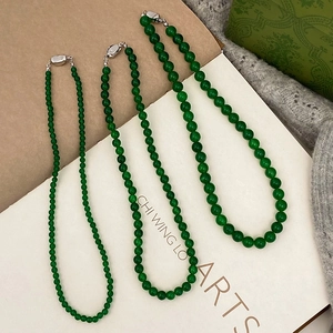 Detailed comparison of three green chalcedony beaded necklaces with silver metal clasps