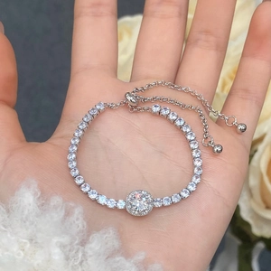 Detail of silver halo adjustable tennis bracelet with micro-paved cubic zirconia