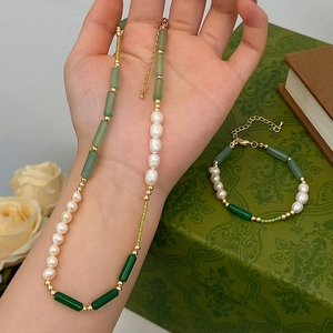 Elegant natural pearl and green stone jewelry set with necklace and bracelet