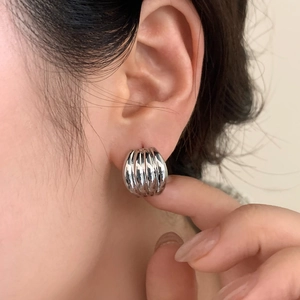Minimalist silver pleated metal hoop earrings featuring elegant vertical stripe texture