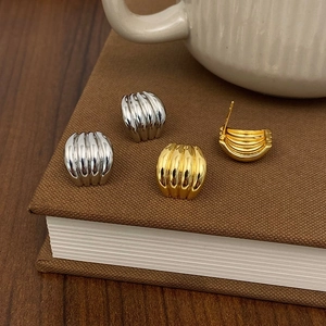 Minimalist metallic croissant stud earrings in gold and silver finish for women