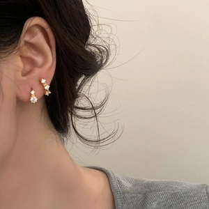 Elegant gold plated zircon stud earring set shown on model for a minimalist luxury look