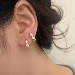 Minimalist gold plated zircon earrings featuring multi-layered stud and solitaire designs