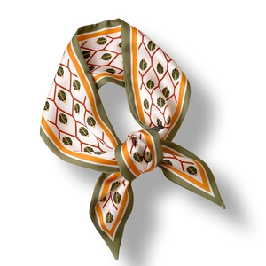 Silk-like skinny scarf with sage green and orange geometric diamond patterns