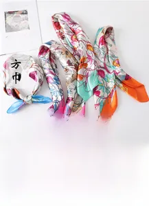 Detail of multi-color floral print silk squares in 60x60cm size with smooth glossy finish