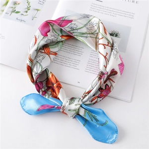 Detail of floral silk scarf with hand-painted patterns and fine rolled edges