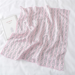 Detail of pink silk-like square scarf with chain pattern and fine stitched edges