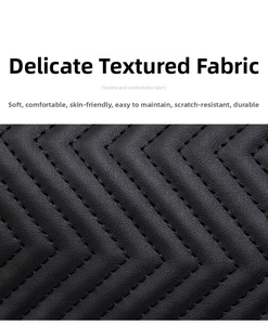 Detail of black quilted leather texture featuring durable and soft V-pattern stitching