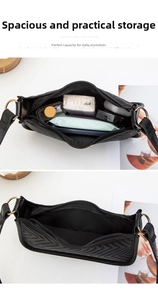 Detail view showing large interior capacity of quilted black shoulder bag with gold hardware