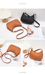 Detail of small chevron quilted crossbody bags in brown and black with metal zippers