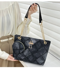 Quilted denim tote bag detail featuring gold chain strap and mini round coin purse