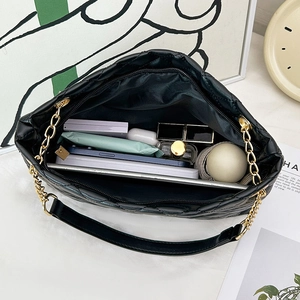 Quilted cylinder crossbody bag with spacious interior for phone and accessories