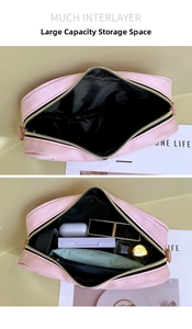Detailed view of pink PU leather makeup bag with large capacity and multi-layer storage