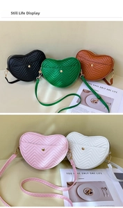 Detail view of heart-shaped crossbody bags featuring premium chevron quilted PU leather