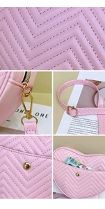 Detail of pink heart crossbody bag featuring chevron quilting and gold metal hardware