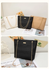 Close-up of V-quilted tote bags with gold chains in white, black, and beige colors