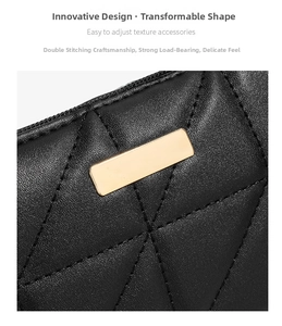 Detail of black leather texture with geometric double stitching and gold metal hardware