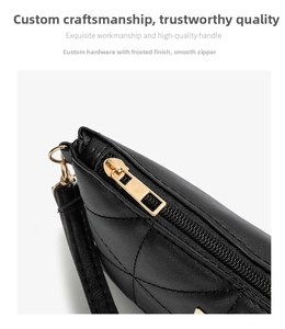 Detail of smooth gold zipper and matte hardware on black quilted faux leather crossbody bag