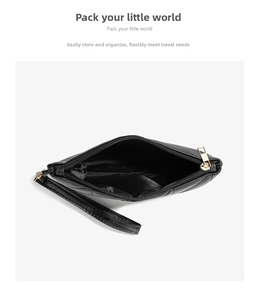 Detail view of black quilted mini bag with gold zipper and fabric interior
