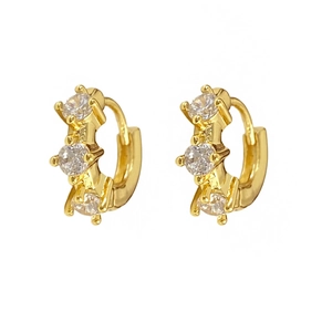 Elegant gold-plated hoop earrings with three sparkling zircons in a minimalist style