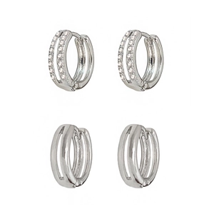 Minimalist silver huggie earrings set with zircon micro-pave and smooth metal finish