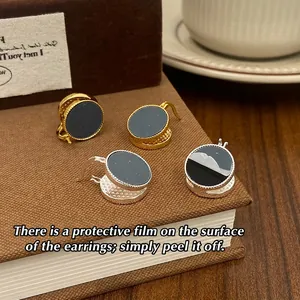 French vintage round stud earrings in gold and silver finish with black enamel center