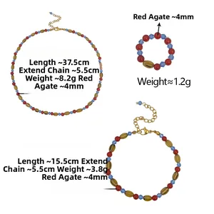 Macro detail of red agate necklace set with blue crystal beads and golden clasp