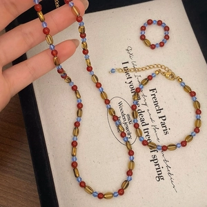 Bohemian style red agate beaded necklace bracelet and ring set with golden accents