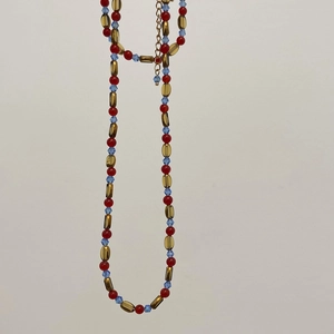 Red agate and blue faceted bead necklace with gold oval accents and adjustable chain