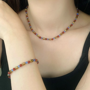 Bohemian style necklace and bracelet set with red agate and multi-color beaded charms