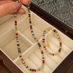 Colorful natural stone beaded necklace and bracelet set with elegant gold metal accents