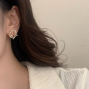 French vintage gold pearl wreath earrings with sparkling diamonds on female model