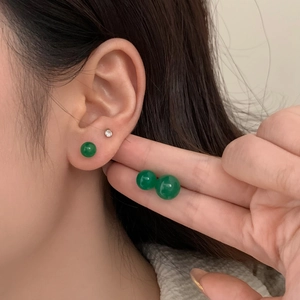 Minimalist green chalcedony stud earrings in 6mm and 8mm sizes shown on model