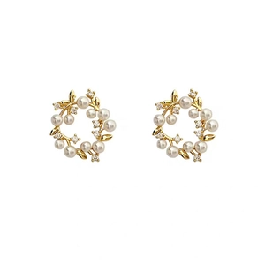 Elegant gold wreath earrings with pearls and zircon crystals in a French vintage style