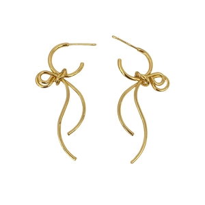 Elegant gold bow earrings with long wavy tassels and S925 silver studs on white background
