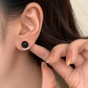 Elegant silver stud earrings featuring a black pearl and micro-set zircon accents