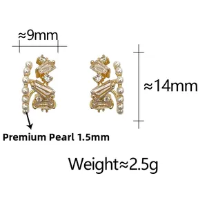 Macro detail of gold earrings with cubic zirconia and 1.5mm pearls with size specifications